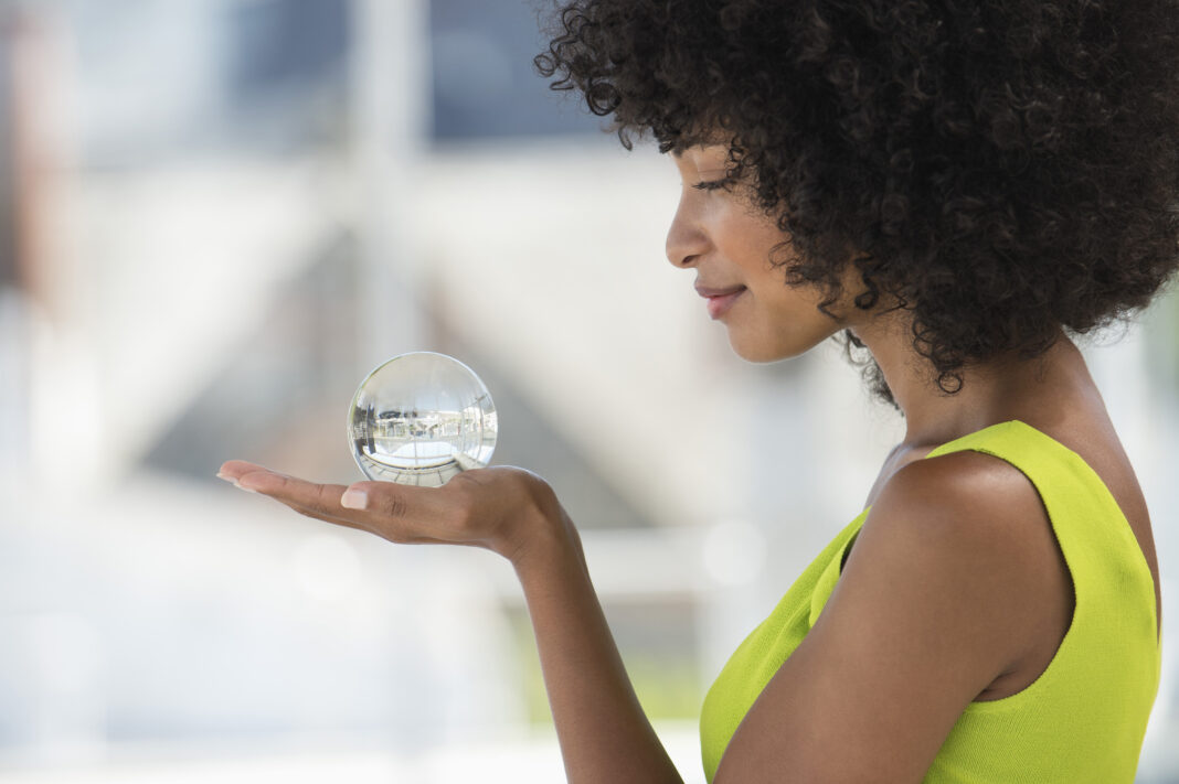 Close-up of a woman holding a crystal ball