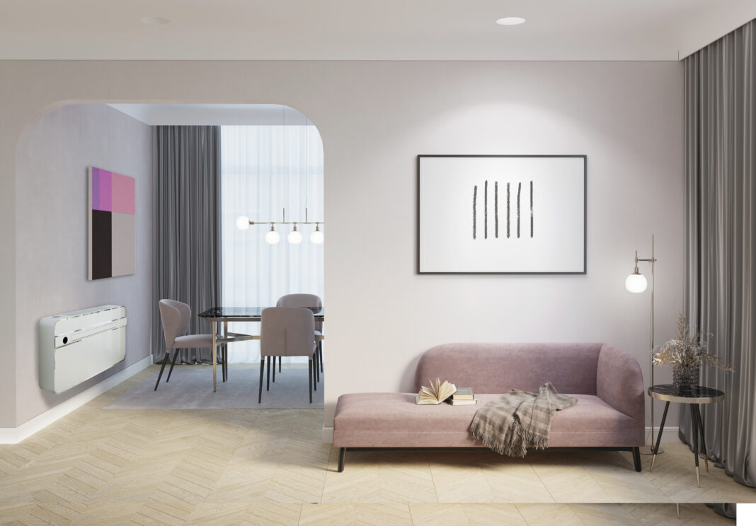 A cozy room with a backlit horizontal poster over a pink couch, a floor lamp and flowers in a vase on a coffee table next to the gray curtains, and an arch overlooking the dining room.